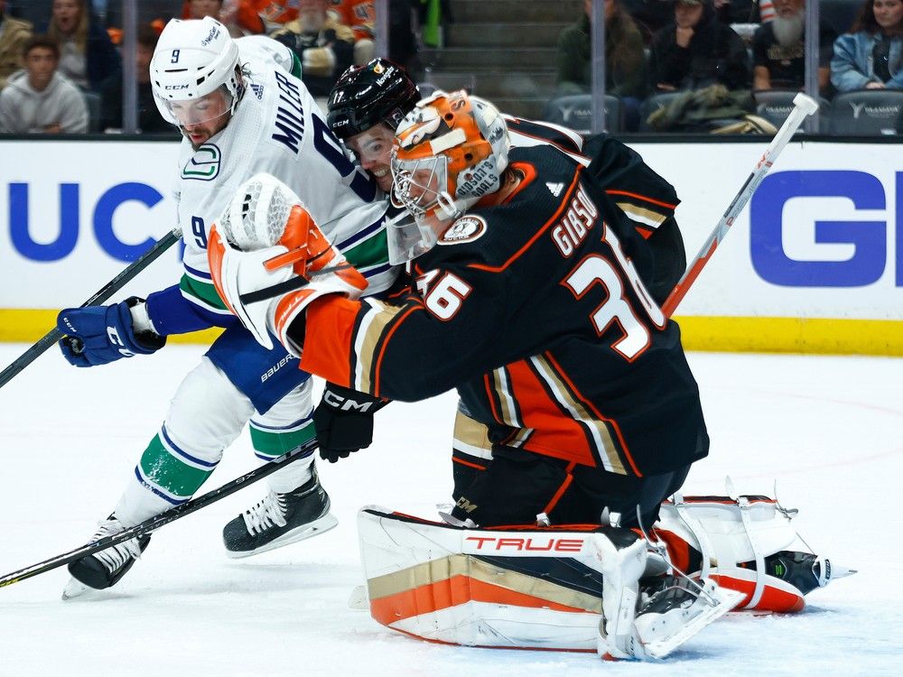 John Gibson of the Anaheim Ducks makes a save against the Vancouver Canucks in the first period at Honda Center on March 19, 2023 in Anaheim, California.