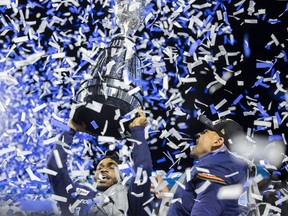 Toronto Argonauts wide receiver Brandon Banks (16) and Toronto Argonauts running back Andrew Harris (33) celebrate after defeating the Winnipeg Blue Bombers during the 109th Grey Cup at Mosaic Stadium on Sunday, November 20, 2022 in Regina.