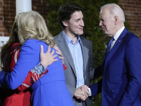 President Joe Biden and first lady Jill Biden are greeted by Canadian Prime Minister Justin Trudeau, second from right, and his wife Sophie Gregoire Trudeau, left, at Rideau Cottage, Thursday, March 23, 2023, in Ottawa, Canada.