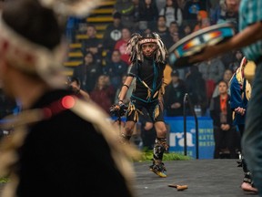 A young First Nations dancer performs during the Junior All Native Tournament basketball tournament, in Nanaimo on March 19, 2023.