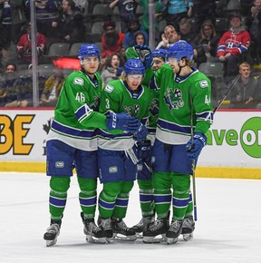 Jack Rathbone (second from left) celebrates with teammates after he scored a goal last season.
