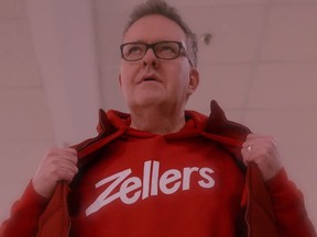 Brittlestar wearing a red vest over a red hoody emblazoned with Zellers logo.