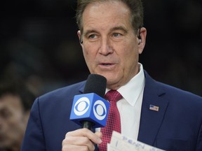 CORRECTS DAY/DATE TO SUNDAY, MARCH 12 INSTEAD OF SATURDAY, MARCH 11 - CBS announcer Jim Nantz begins the broadcast of an NCAA college basketball championship game between Penn State and Purdue at the Big Ten men's tournament, Sunday, March 12, 2023, in Chicago.