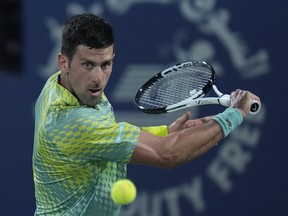 Serbia's Novak Djokovic returns the ball to Daniil Medvedev during their semi final match of the Dubai Duty Free Tennis Championships in Dubai, United Arab Emirates, Friday, March 2, 2023.