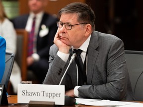 Shawn Tupper, Deputy Minister of the Department of Public Safety and Emergency Preparedness, waits to appear as a witness at the Standing Committee on Procedure and House Affairs regarding foreign election interference on Parliament Hill in Ottawa, Wednesday, March 1, 2023.