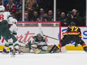Minnesota Wild goalie Marc-Andre Fleury stops Vancouver Canucks’ Anthony Beauvillier during the second period of an NHL hockey game in Vancouver, on Thursday, March 2, 2023.