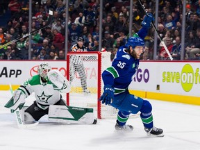 Vancouver Canucks defenceman Guillaume Brisebois (55) celebrates his goal on Dallas Stars goalie Matt Murray (32) in the third period at Rogers Arena.