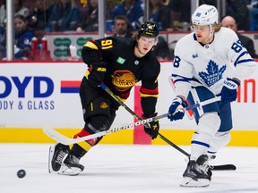 Vancouver Canucks forward Vitali Kravtsov watches as Toronto Maple Leafs forward William Nylander makes a pass in the first period at Rogers Arena March 4, 2023.