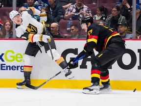 Vegas Golden Knights forward Jack Eichel (9) shoots around Vancouver Canucks defenseman Tyler Myers (57) in the second period at Rogers Arena in March.