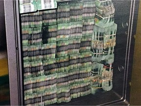 Bundles of 20-dollar bills sezied in October 2015 as part of RCMP E-Pirate investigation into money laundering at alleged underground Richmond bank, Silver International.