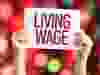 031623-Living_Wage_placard_with_urban_background