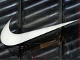 The Nike swoosh logo is seen outside the store on 5th Avenue in New York, New York, U.S., March 19, 2019. REUTERS/Carlo Allegri/File Photo