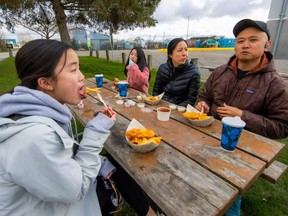 Jack Yee and Priscilla Lai with children Gabriella and Samantha drove from Vancouver to enjoy food from Pajo's at Garry Point Park in Steveston.