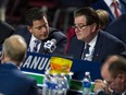 Vancouver Canucks scouting director Judd Brackett talks to GM Jim Benning during Day 2 of the 2019 NHL Draft at Rogers Arena in Vancouver, BC Saturday, June 22, 2019.