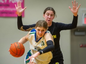 Riverside Rapid’s #13 Natalie Curly in front of Kelowna Owls #11 Tennyson McCarthy in Girls basketball Quarterfinal round at Langley Events Centre in Langley, BC., March 2, 2023.