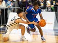 Torian Lee of Semiahmoo tries to evade Andy Chen of Burnaby South in last year's Quad A boys provincial final at the Langley Events Centre. Burnaby South won 72-57.