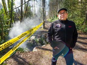 Squamish Nation Coun. Wilson Williams stands beside a sewage leak in North Vancouver.