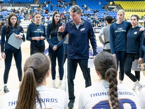 UBC Thunderbirds women’s volleyball coach Doug Reimer talks to his team during a timeout.