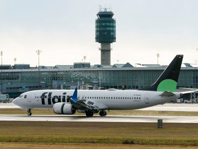 A Flair Airlines plane lands at Vancouver International Airport