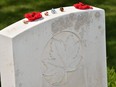 A picture shows objects placed on a grave in the Canadian First World War military cemetery in Vimy, near Arras, northern France, on April 9, 2017, during a commemoration ceremony to mark the 100th anniversary of the Battle of Vimy Ridge, a World War I battle which was a costly victory for Canada, but one that helped shape the former British colony's national identity.
