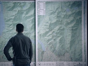 North Search and Rescue team leader Mike Danks looks at map as he and the team prepare to go out on a cold case search.