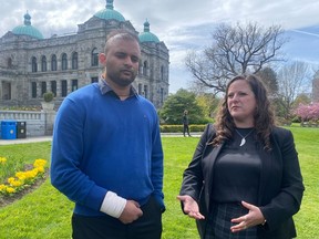 Aman Sood, the Uber driver who was attacked on the job and left unable to work, with the president of the B.C. Federation of Labour,  Sussanne Skidmore, at the B.C. legislature in Victoria on April 26, 2023.