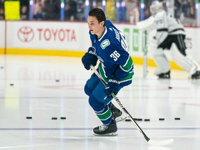 Akito Hirose skates the first lap of warm-up by himself prior to his first NHL game against the Los Angeles Kings on April, 2, 2023 at Rogers Arena in Vancouver, British Columbia, Canada.