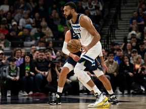 Rudy Gobert of the Minnesota Timberwolves handles the ball during an April 9, 2023 NBA game against the New Orleans Pelicans at the Target Center in Minneapolis, Minn.
