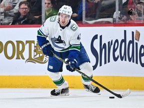 Quinn Hughes of the Vancouver Canucks skates the puck against the Montreal Canadiens during the first period at Centre Bell on Nov. 9, 2022 in Montreal, Quebec, Canada.