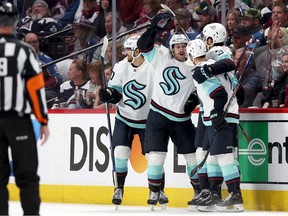 Tye Kartye #52 of the Seattle Kraken celebrates with Matty Beniers #10, Will Borgen #3, and Jordan Eberle 7 after scoring against the Colorado Avalanche in the second period during Game Five of the First Round of the 2023 Stanley Cup Playoffs at Ball Arena on April 26, 2023 in Denver, Colorado.