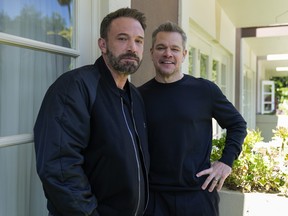 Ben Affleck, left, and Matt Damon pose for a portrait to promote the film "Air" at the Four Seasons Hotel in Los Angeles.