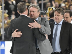 Rick Bowness head coach of the Winnipeg Jets hugs John Stevens assistant coach of the Vegas Golden Knights after Game 5 of their series.