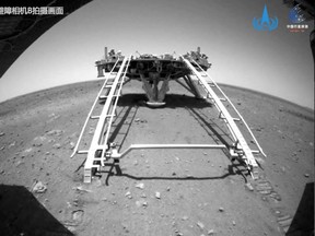 Chinese rover Zhurong of the Tianwen-1 mission drives down the ramp of the lander onto the surface of Mars, in this screenshot taken from a video released by China National Space Administration (CNSA) May 22, 2021.