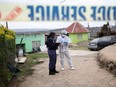 Police work at the scene of a deadly mass shooting near Pietermaritzburg, South Africa, Friday, April 21, 2023.