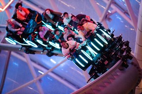 As members of Team Blue, guests board high-speed Lightcycles for a thrilling race through a dark, computerized world of the Grid made famous in the TRON movies.