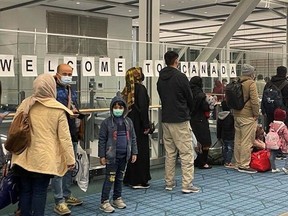 S.U.C.C.E.S.S.'s community airport newcomers network program greets people arriving from Afghanistan in 2022.