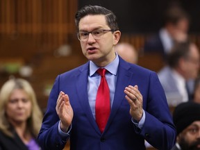 Conservative Leader Pierre Poilievre rises during Question Period in the House of Commons on Parliament Hill in Ottawa on Friday, March 31, 2023. Poilievre sent a letter to Twitter asking the company to tag CBC's various news-related accounts with a "government-funded media" label.