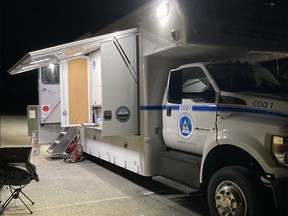 A Coquitlam Search and Rescue support vehicle set up at night.