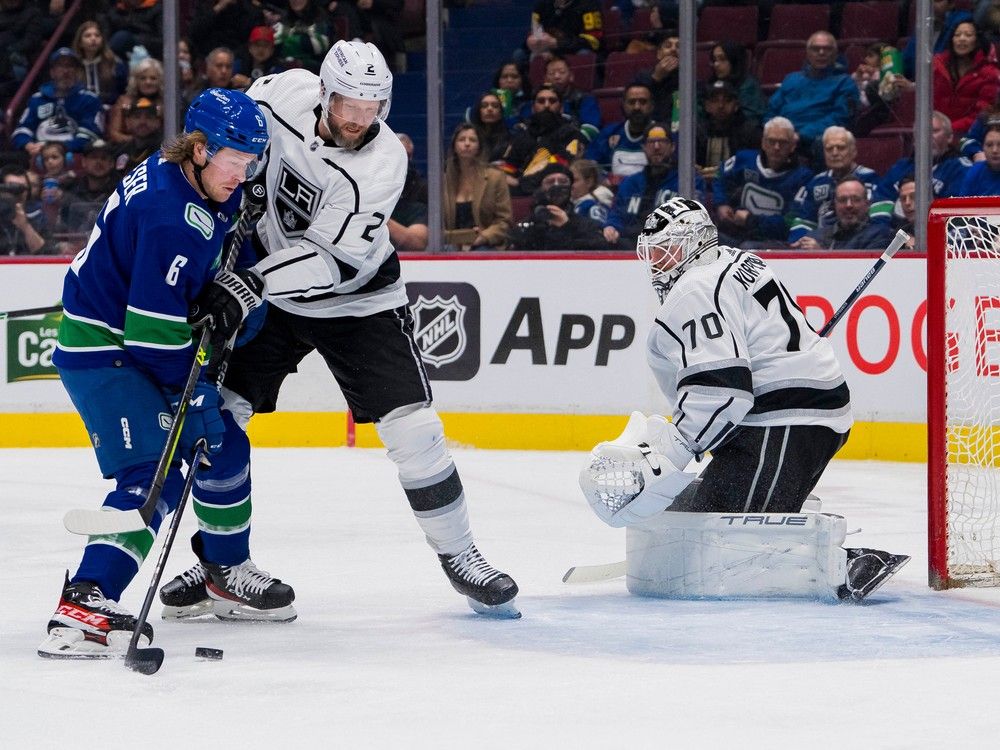 Los Angeles Kings goalie Joonas Korpisalo (70) watches as defenceman Alexander Edler (2) battles with Vancouver Canucks forward Brock Boeser (6) in the first period at Rogers Arena. Boeser would score on the play.