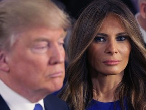 Donald Trump and his wife Melania greet reporters in the spin room following a debate sponsored by Fox News at the Fox Theatre on March 3, 2016 in Detroit, Michigan.