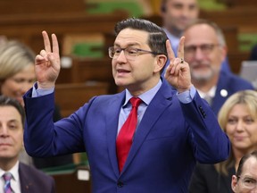 Conservative Leader Pierre Poilievre rises during Question Period in the House of Commons on Parliament Hill in Ottawa on Friday, March 31, 2023. If Poilievre wants to "defund the CBC" while maintaining its French-language services, he'll have to overhaul the country's broadcasting law in order to do it.