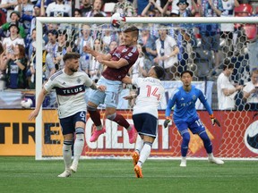 Colorado Rapids forward Diego Rubio (11) goes up for a header against Vancouver Whitecaps FC defender Tristan Blackmon and defender Luis Martins during the first half at B.C. Place Apr 29, 2023.