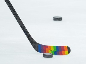 Rainbow tape is seen on Vancouver Canucks' Aidan McDonough's stick as players also wear pride-themed warmup jerseys during the pre-game skate before an NHL hockey game against the Calgary Flames in Vancouver, on Friday, March 31, 2023. The Montreal Canadiens haven't confirmed whether all of the team's players will wear themed warm-up jerseys during Pride night Thursday against the Washington Capitals.