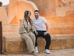 This handout picture provided by the Saudi Tourism Authority shows Argentine forward Lionel Messi, his wife Antonela Roccuzzo visiting Diriyah near Riyadh.