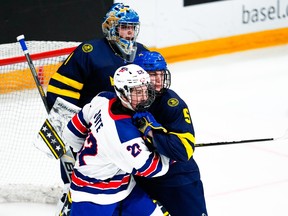 Will Vote of United States (L) fighting for a position into the slot against Tom Willander of Sweden (R) during final of U18 Ice Hockey World Championship match between United States and Sweden on April 30, 2023.