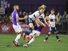 Pacific FC defender Jordan Haynes (3) collides with Vancouver Whitecaps defender Florian Jungwirth (26) during the second half at the Starlight Stadium.