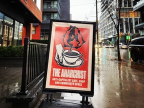 Outdoor sign of The Anarchist, an anti-capitalist coffee shop in Toronto.