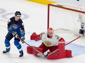 Russia’s Yaroslav Askarov (1) and Finland’s Henri Nikkanen (28) watch during first period IIHF World Junior Hockey Championship bronze medal action on Tuesday, Jan. 5, 2021 in Edmonton.