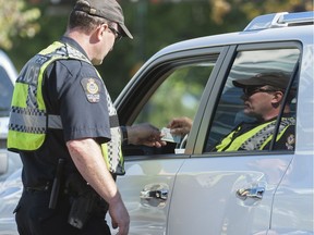 A Vancouver police officer at a distracted-driving checkstop.