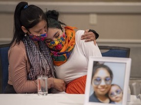 Kyla Frenchman, right, mother of Tanner Brass, is comforted by her sister (name unknown) during a media event organized by The Federation of Sovereign Indigenous Nations in Saskatoon, Wednesday, March 2, 2022. The Public Complaints Commission in Saskatchewan has found police officers neglected their duty before the toddler was killed in Prince Albert in 2022.